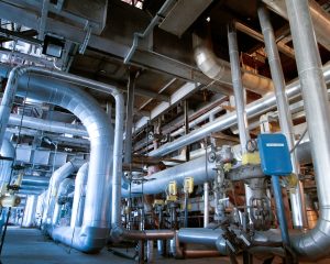 stock-photo-equipment-cables-and-piping-as-found-inside-of-a-industrial-power-plant-1928217341